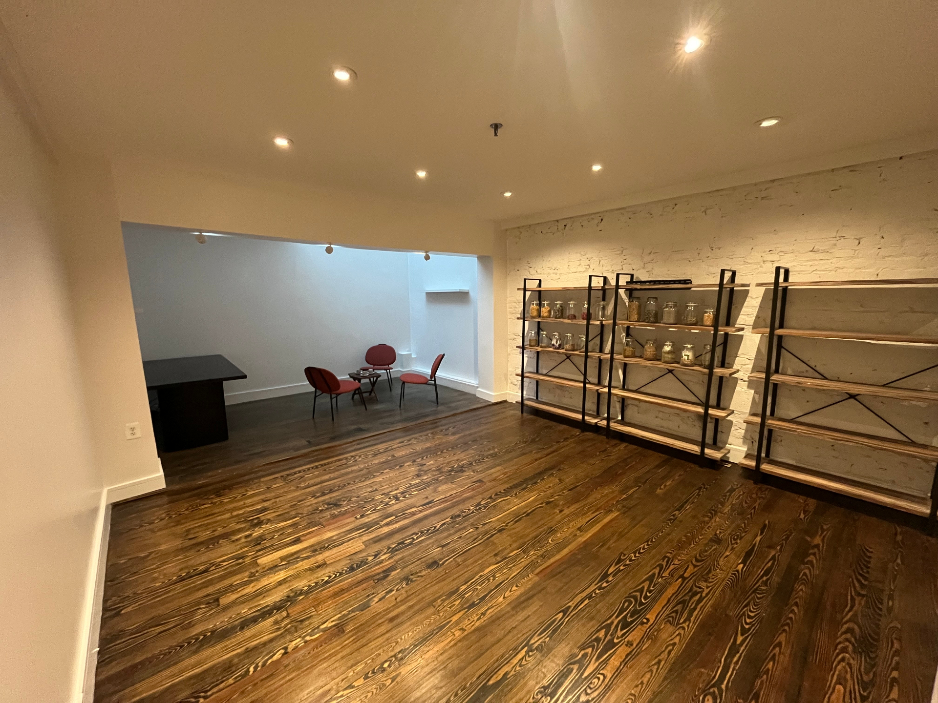Book Hill Gallery main room with shelving and seating